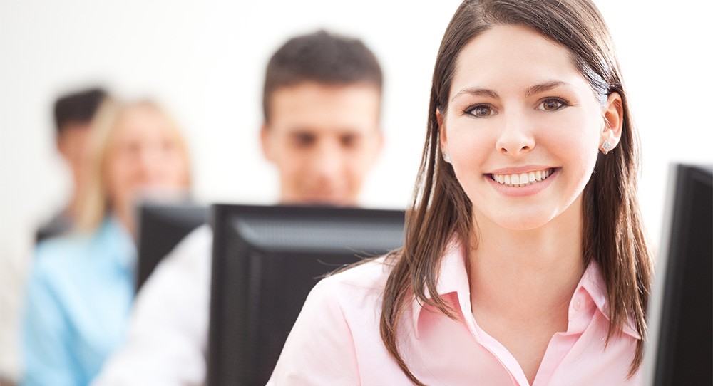Smiling Student Using Computer